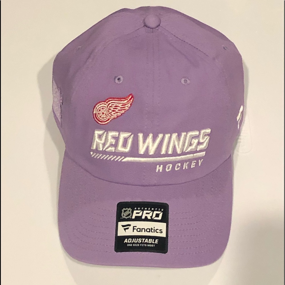 New Detroit Red Wings “Hockey Fights Cancer” hat with stickers. Never Worn.